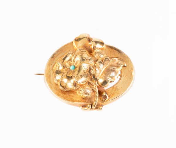Spilla ovale in oro giallo e piccolo turchese  - Auction Jewels and Watches - Casa d'aste Farsettiarte
