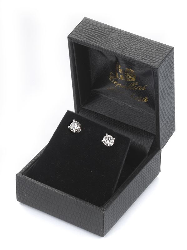 Orecchini punto luce in oro bianco con diamanti  - Auction Jewels and Watches - Casa d'aste Farsettiarte