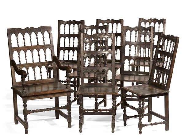 Sette sedie e una poltrona in legno di noce  - Asta Importanti Arredi, Maioliche, Sculture e Dipinti Antichi - Casa d'aste Farsettiarte