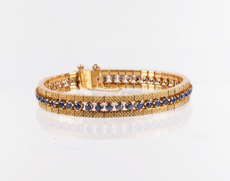 Bracciale a Fascia Snodata in Oro Giallo con Zaffiri