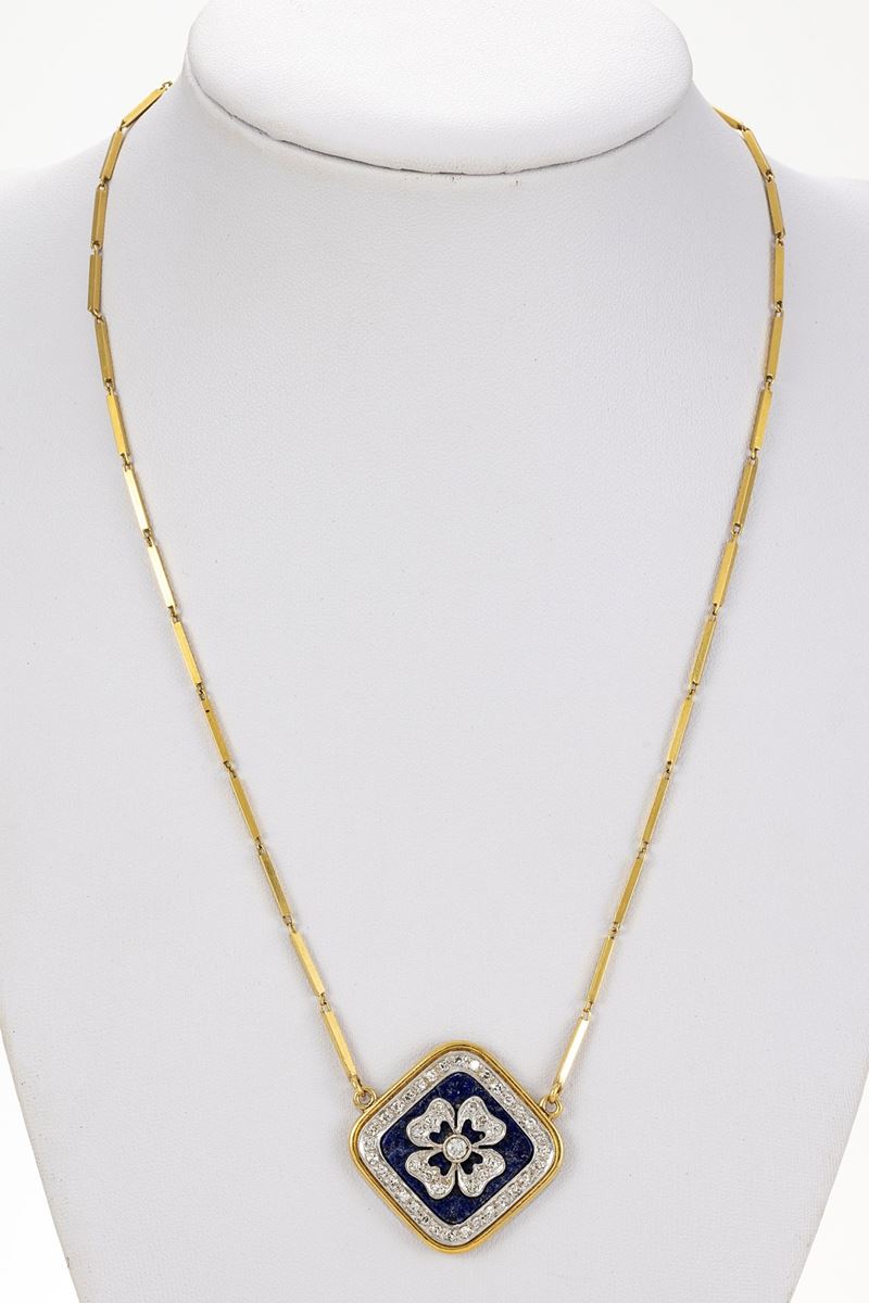 Collana con pendente in oro giallo e bianco