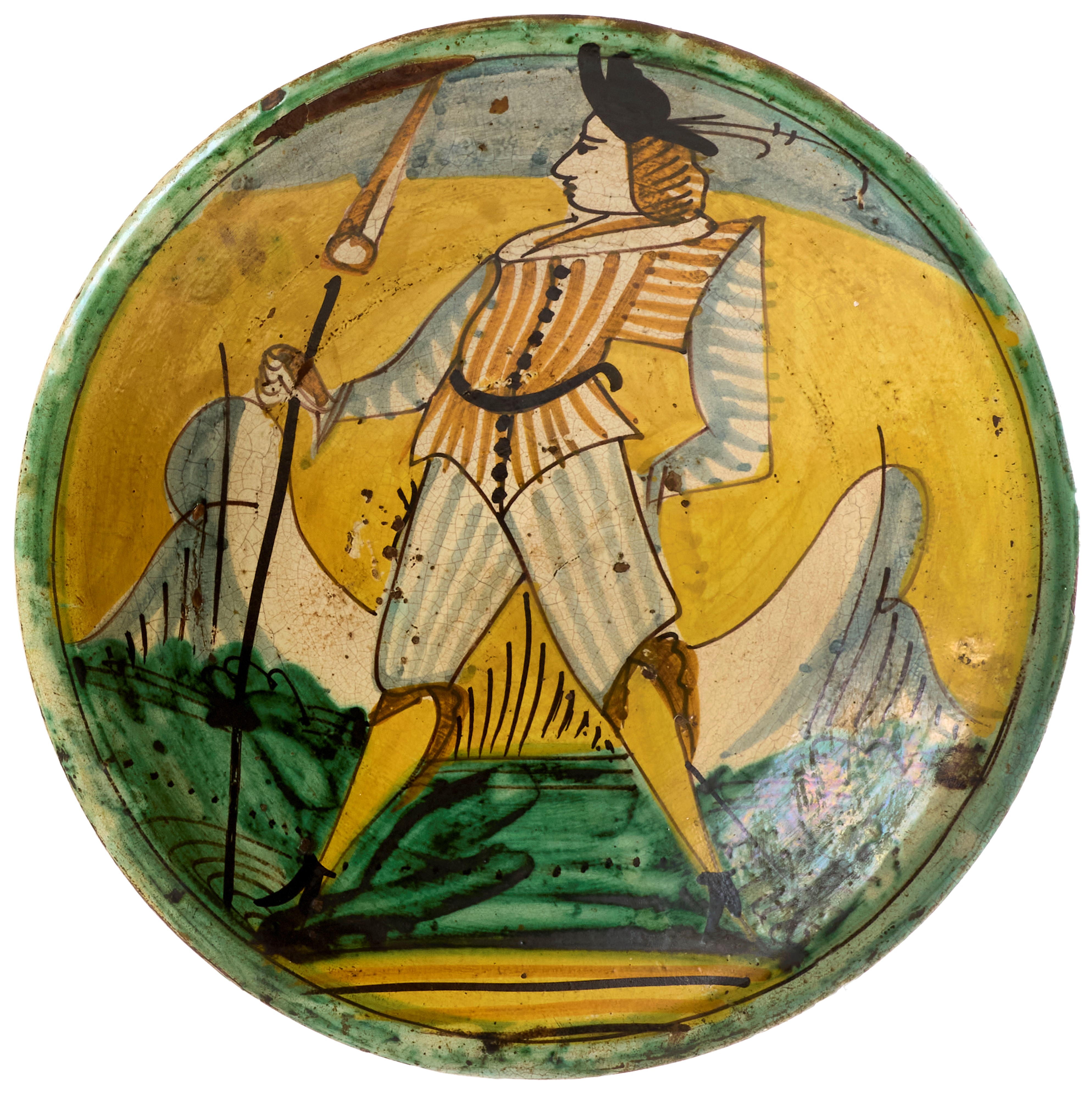Due piatti in maiolica policroma giallo, verde, blu, ocra e manganese