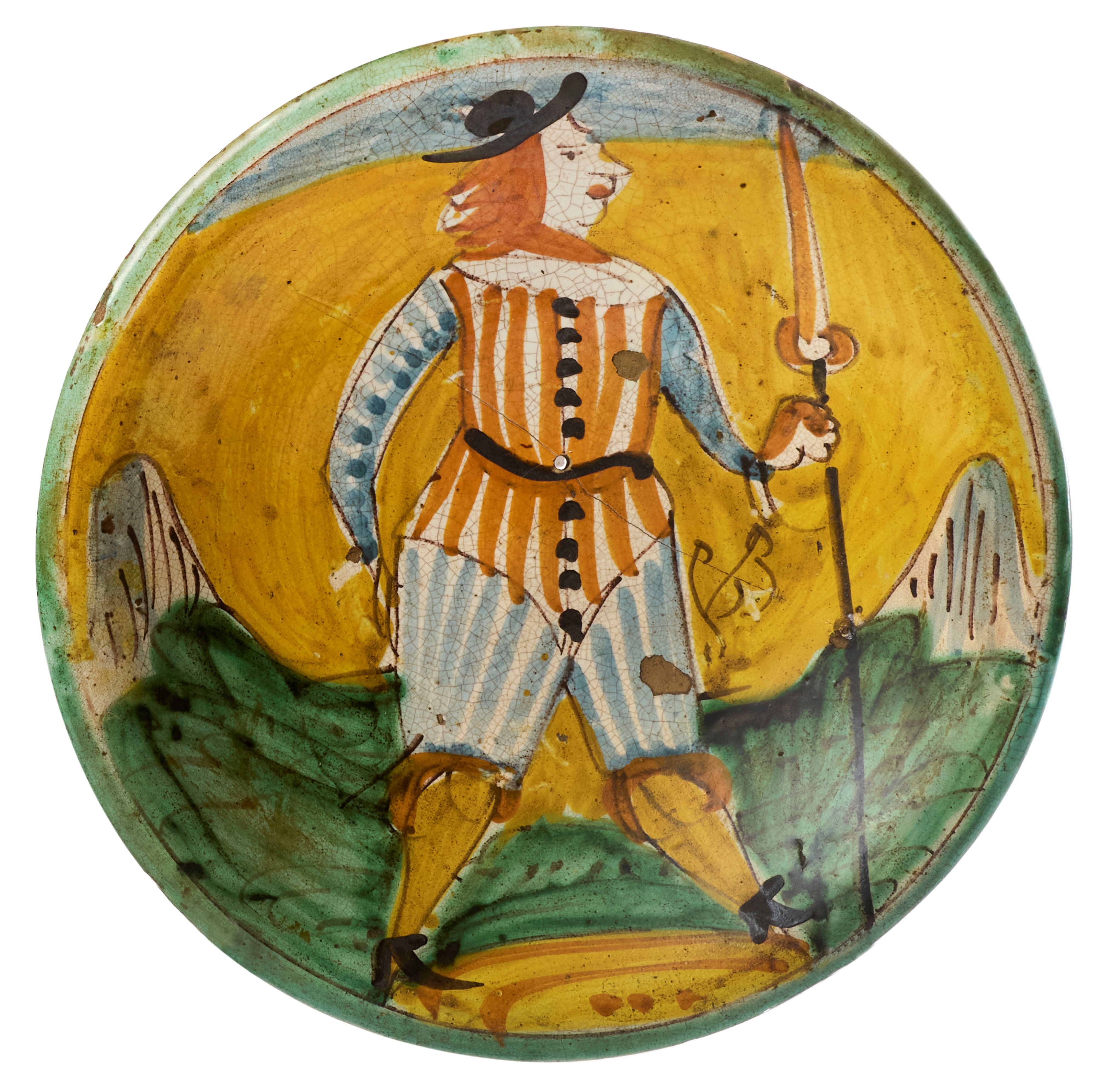 Due piatti in maiolica policroma giallo, ocra, verde, blu e manganese