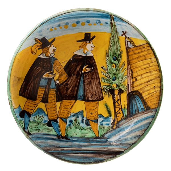 Piatto in maiolica policroma giallo, verde, azzurro e manganese