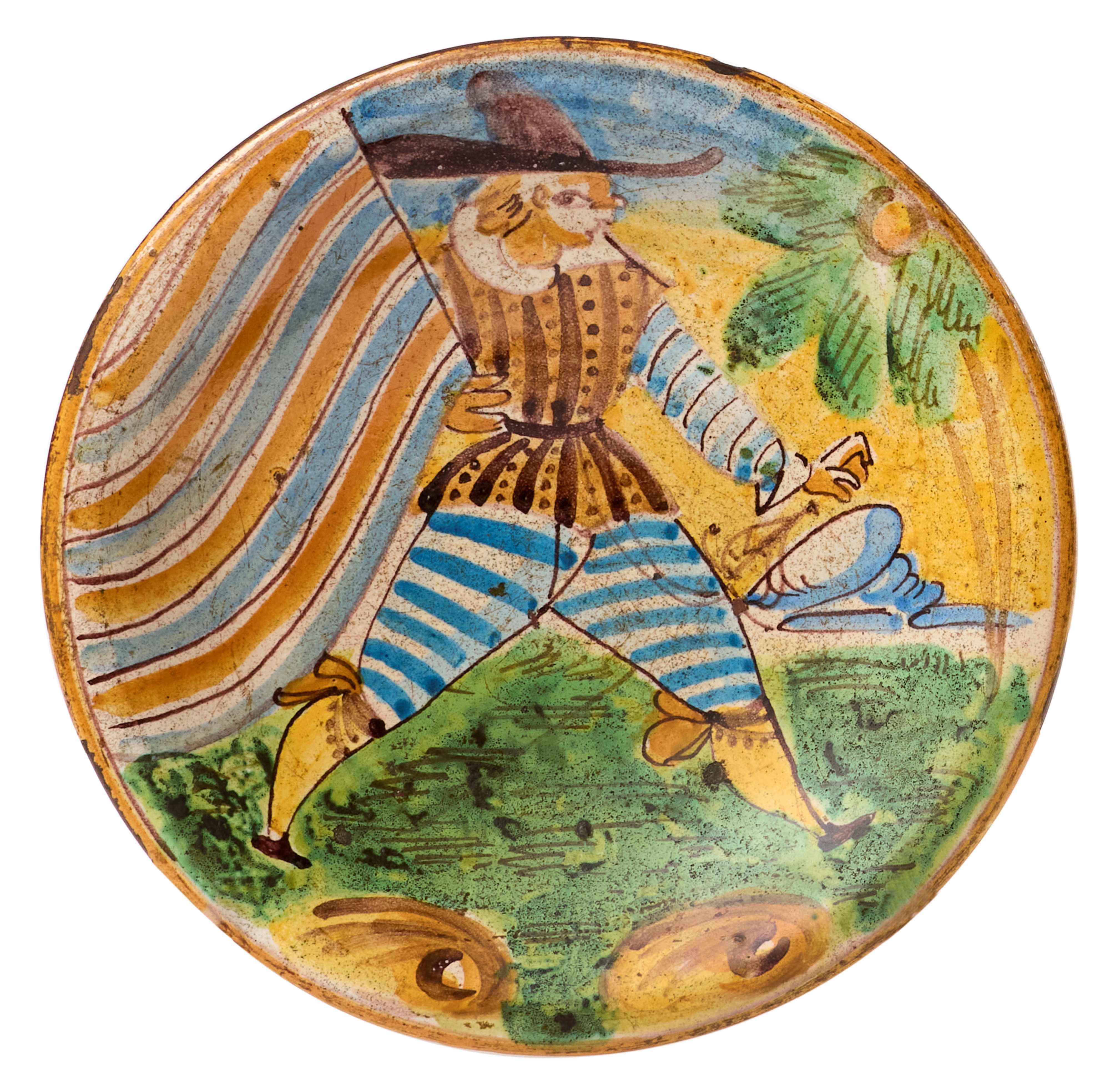 Due piatti in maiolica policroma giallo, ocra, blu e verde