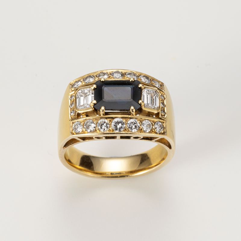 Anello a fascia in oro giallo con zaffiro e diamanti