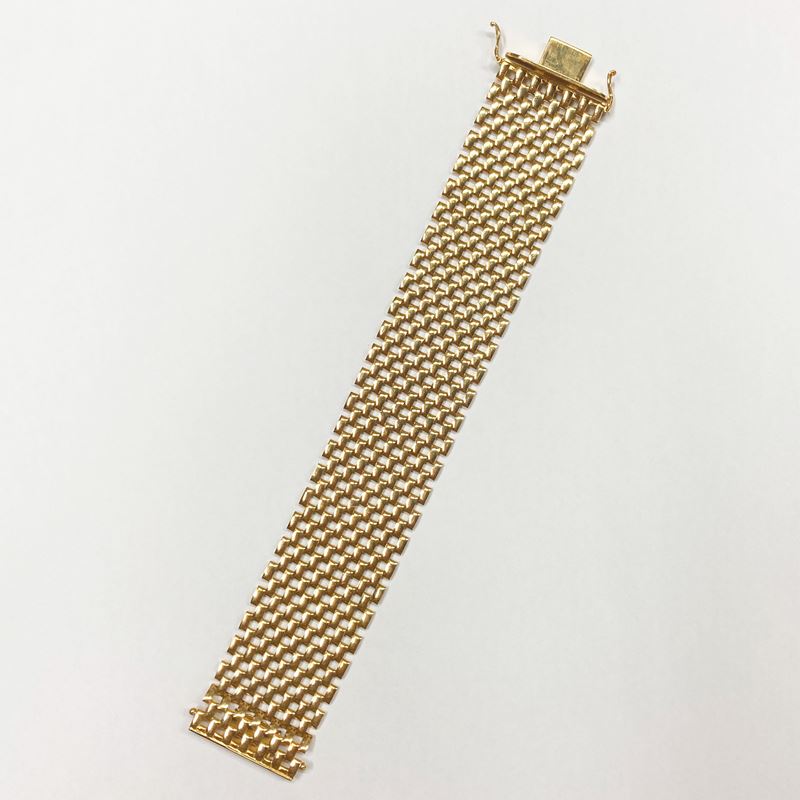 Bracciale a maglia traforata in oro giallo