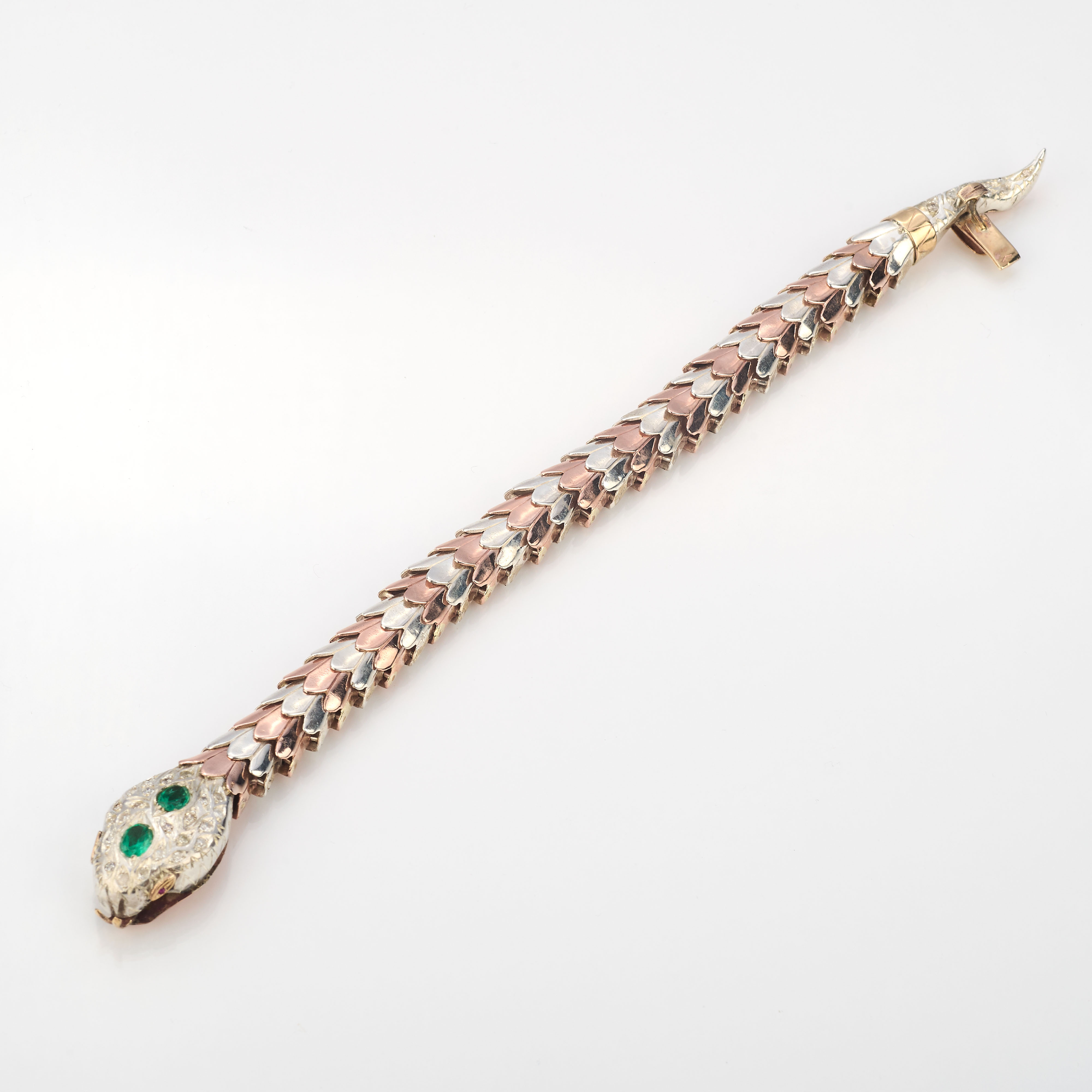 Bracciale a serpente in oro con diamanti e smeraldi