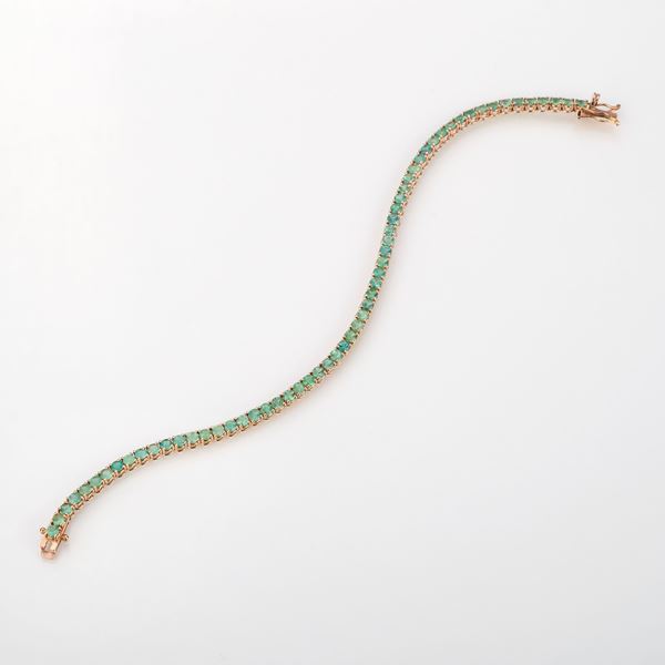 Bracciale tennis in oro giallo e smeraldi
