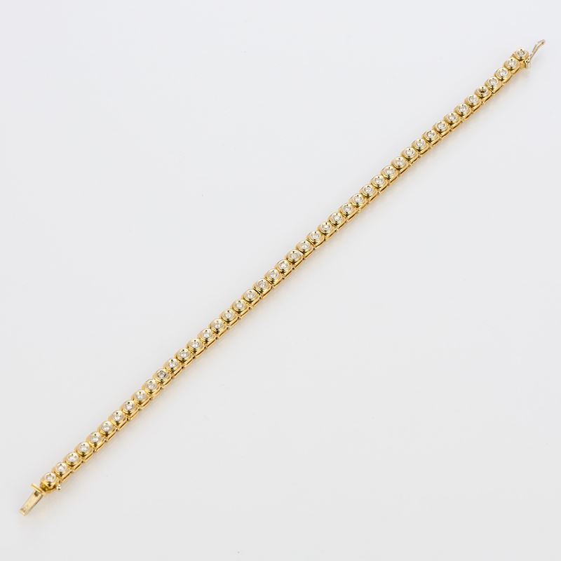 Bracciale tennis in oro giallo e diamanti