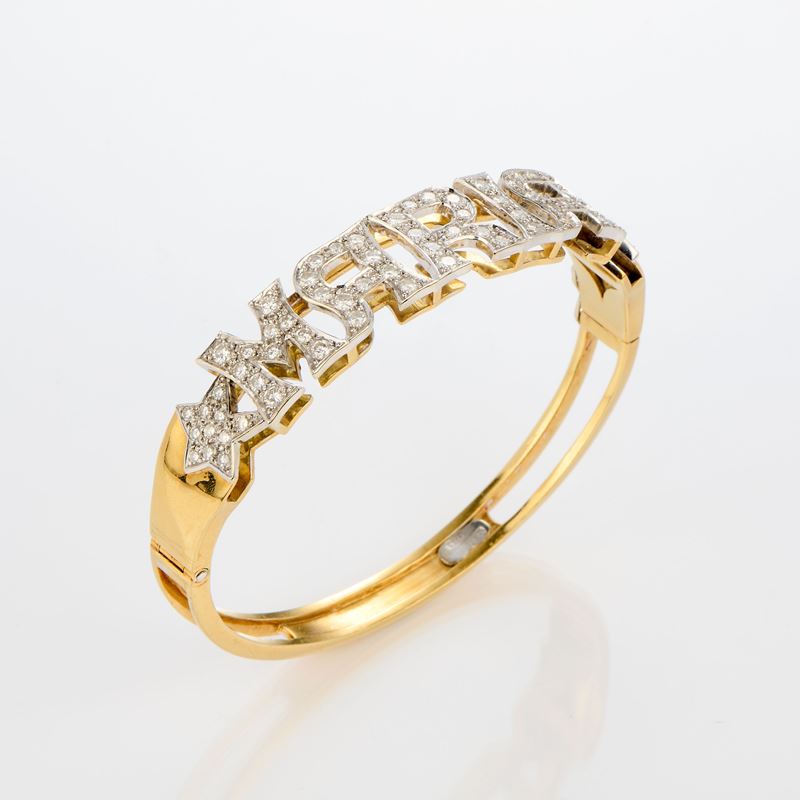 Bracciale a due cerchi rigidi in oro giallo e bianco con diamanti