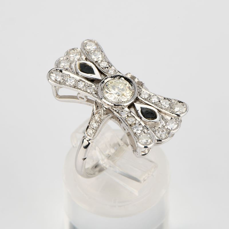 Anello a fiocco in oro bianco con diamanti e smalto nero