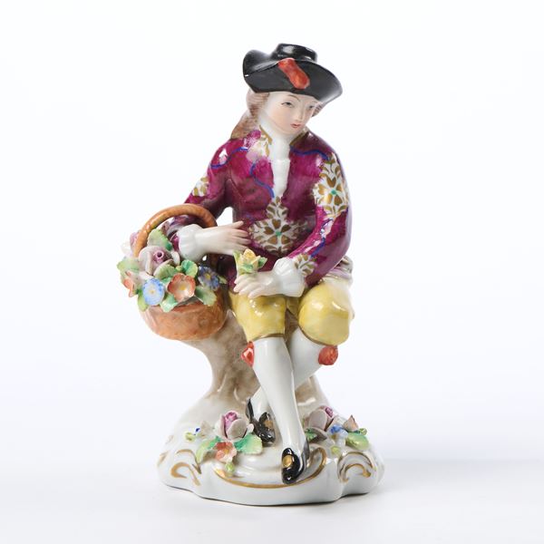 Giovinetto seduto con cesto di fiori