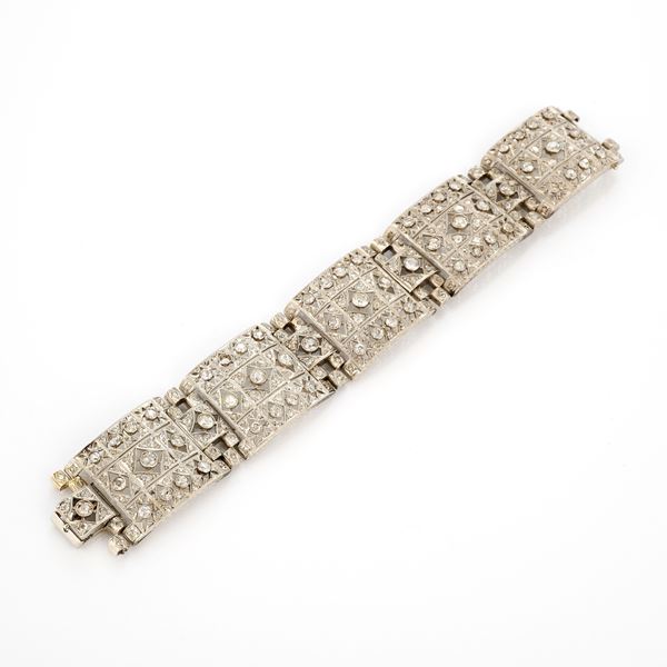 Bracciale a fascia snodata in platino e diamanti