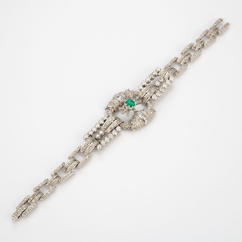 Bracciale a maglie geometriche in platino con diamanti e smeraldo