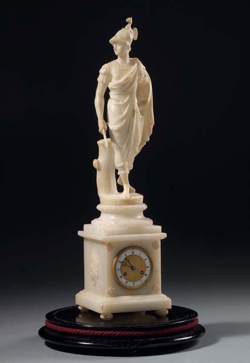Orologio in alabastro statuario raffigurante      «Guerriero», in campana di vetro