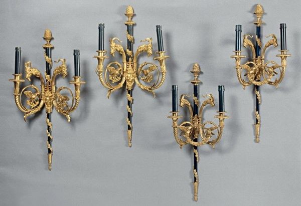 Quattro appliques in bronzo dorato