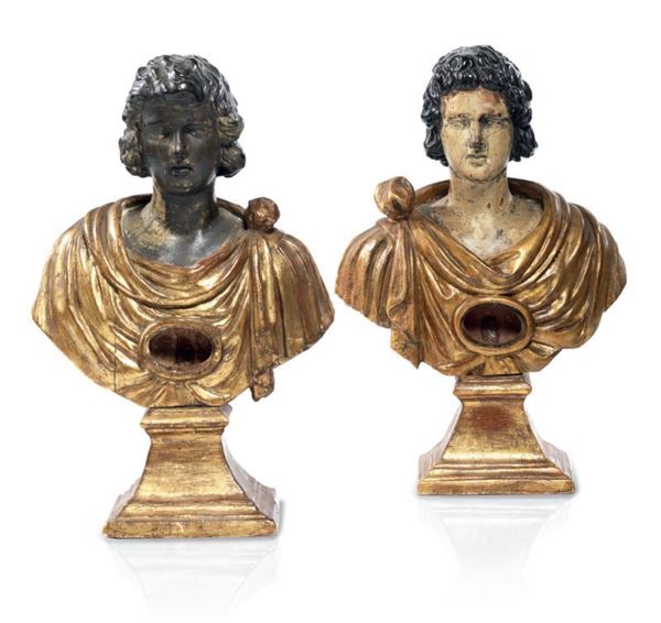 Coppia di sculture-reliquiari in legno laccato e dorato