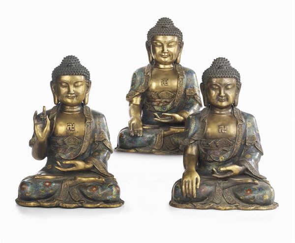 Tre sculture in bronzo dorato e smaltato