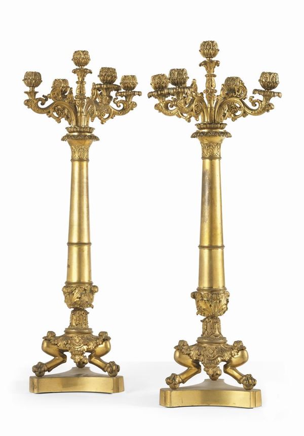 Due candelieri in bronzo dorato