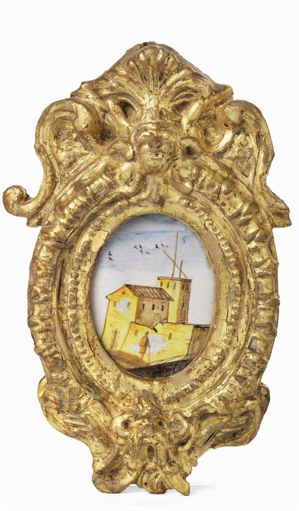 Ambrogetta ovale in maiolica policroma con cornice in terracotta dorata