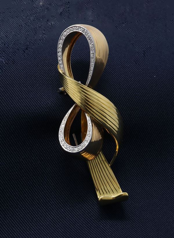 Spilla a fiocco in oro giallo  - Auction Jewelery, Watches and Silver - Casa d'aste Farsettiarte