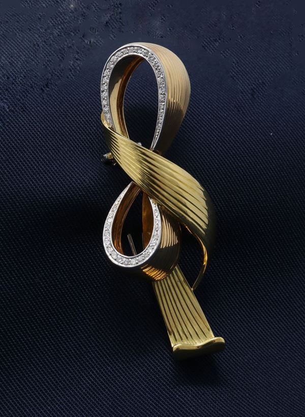 Spilla a fiocco in oro giallo