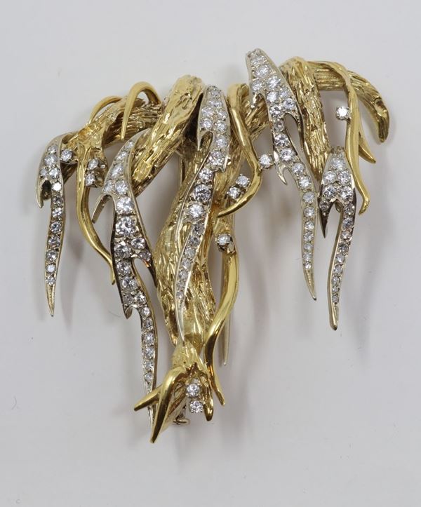 Spilla in oro giallo e bianco