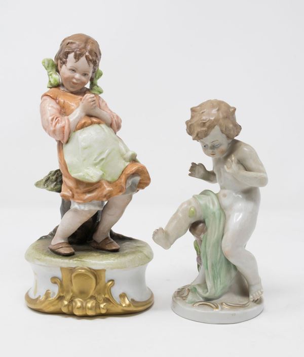 Due statuette in porcellana policroma