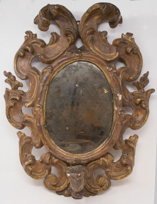 Specchiera ovata in legno intagliato e dorato  - Auction Parade I - Forniture and Old Masters Paintings - I - Casa d'aste Farsettiarte